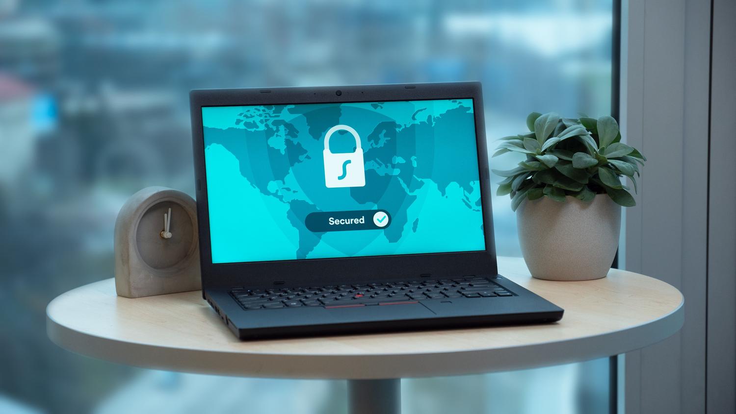 Laptop screen showing a digital security lock icon, representing PowerShell security and execution policies