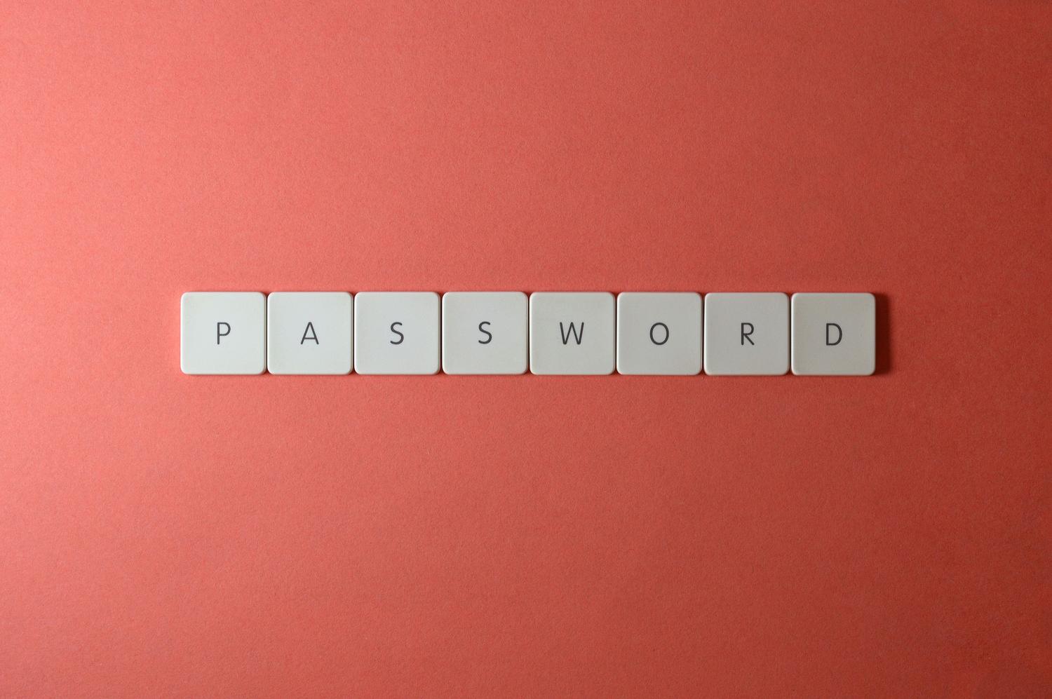 Teclado con la palabra PASSWORD resaltada sobre fondo coral.